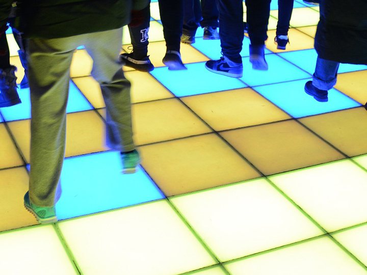 Pressure-sensitive light up floor responding to dancers’ steps