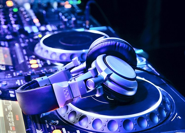 Essential-DJ-gear-mixer,-players,-headphones.